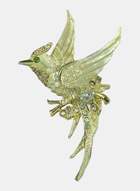 This elegant vintage-style gold-tone bird brooch 3” long by 1.5” wide