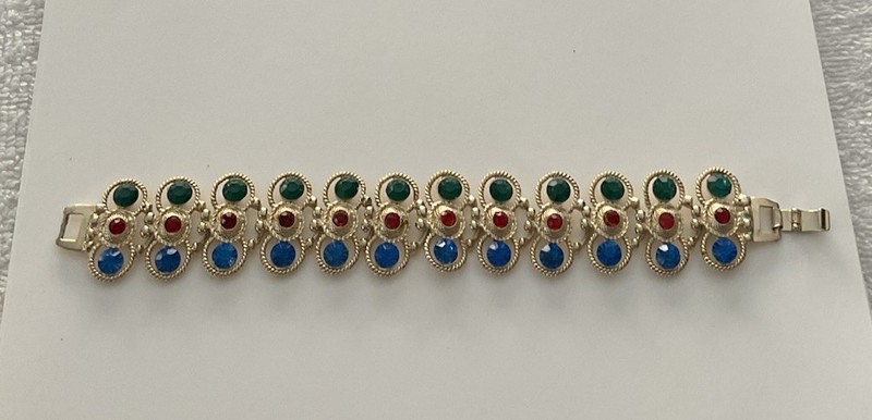 Vintage Gold Tone multi-gemstone link bracelet with a fold-over clasp 7’ in