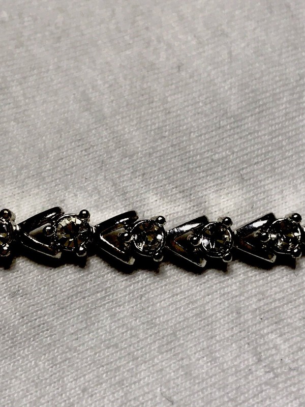 AVON rhinestone bracelet with fold over clasp_ Silver Tone gallery