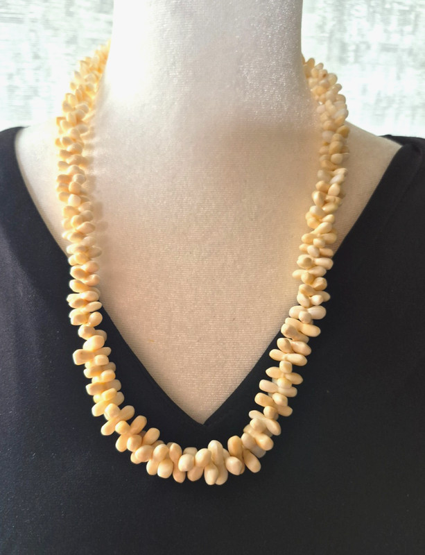 Vintage 23.5″ long seashell necklace, coral-like, with hand-carved graduated bea